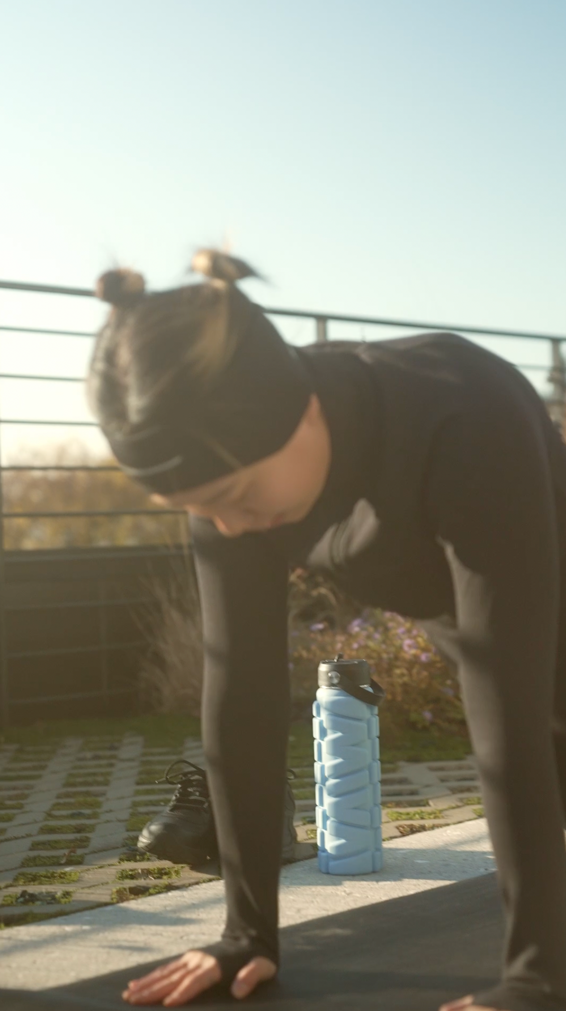 Model using 25 oz Dusty MIVA Recovery Foam Roller Water Bottle