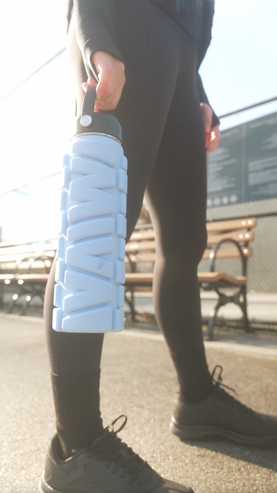 Model holding Dusty MIVA Recovery Foam Roller Water Bottle